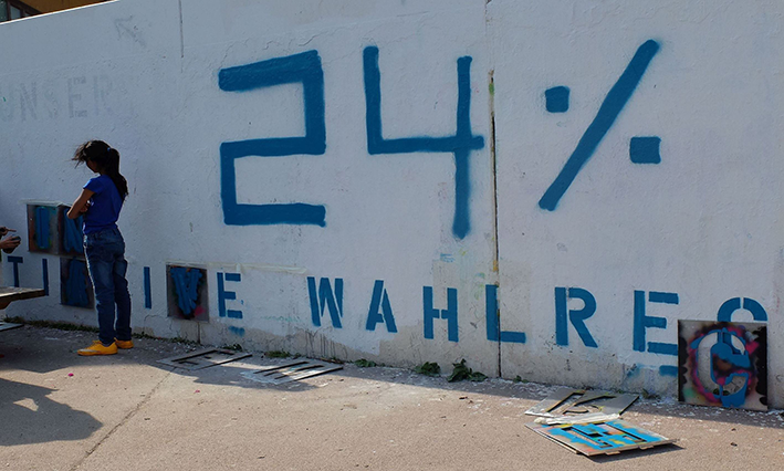 Die Zahl 24 Prozent wurde an eine Wand gesprayed.